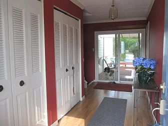 Foyer leads to upper & lower levels & backyard