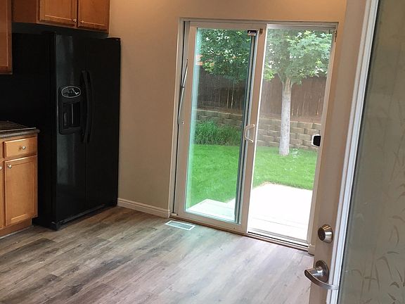 kitchen view out back of house showing new paint and floorin