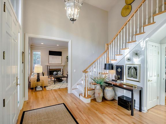 entryway with grand staircase and soaring ceilings