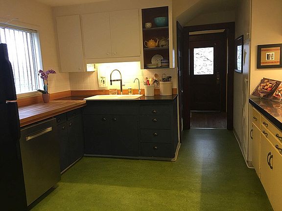 Butcher-block, cast iron farmhouse sink, filtered water, and dishwasher