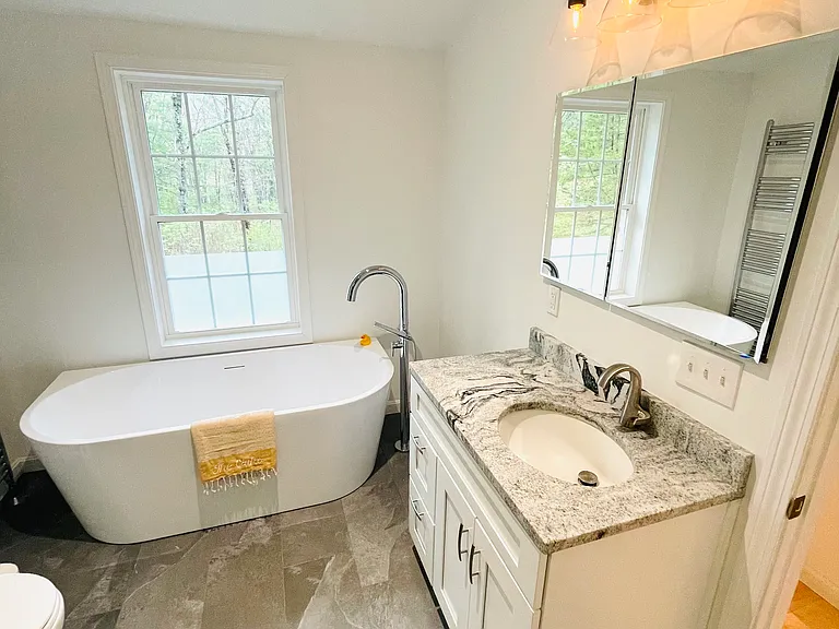 Bathroom: granite sink, large built-in medicine cabinet