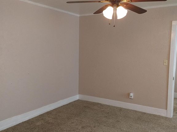 Bedroom with new paint,carpet and ceiling fan