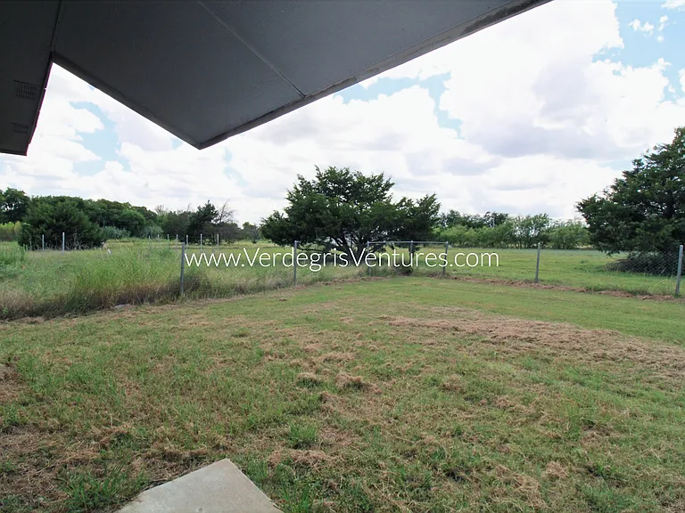 Backyard is fenced in with chainlink and there are no neighbors behind and to the south of the property