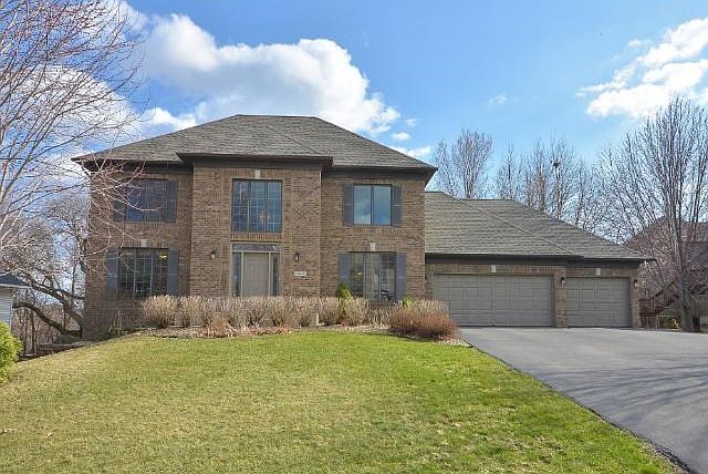 Impressive Two Story Walkout in The Point on a private wooded lot! Finish lower level for additional