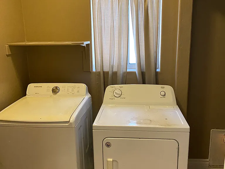 Laundry room with doggie door to side yard.