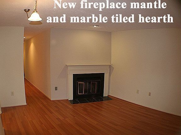 Cherry laminate floor, wood burning fireplace