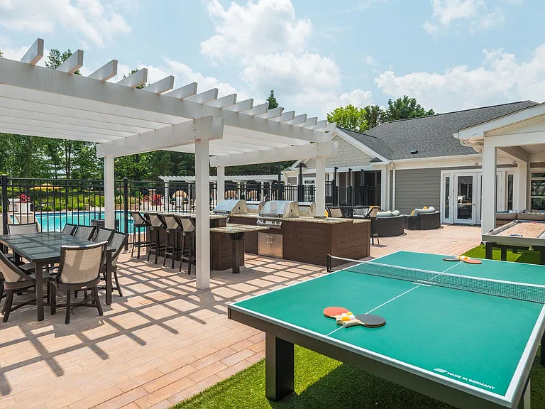 Our outdoor entertainment space includes a ping pong table and shuffleboard.