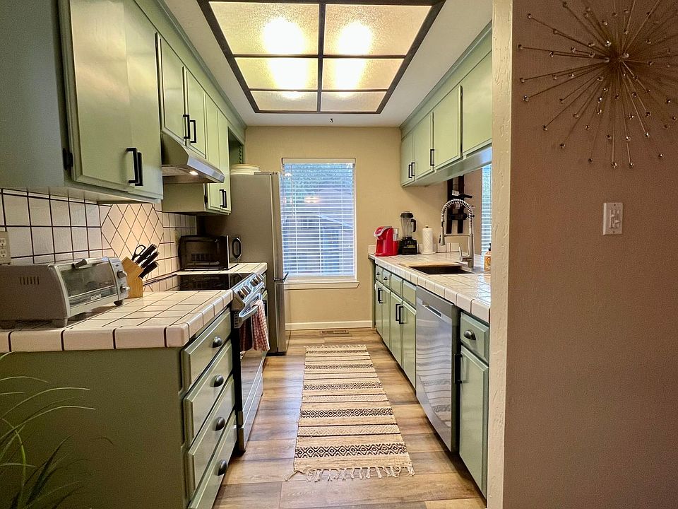 Kitchen has Samsung appliances and ample cabinet space.