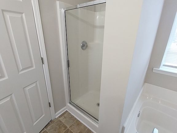 Master bath shower with tile flooring