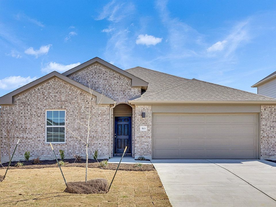 Elegant brick facade with gable roof exudes timeless luxury in the prestigious enclave of Hunters Gl