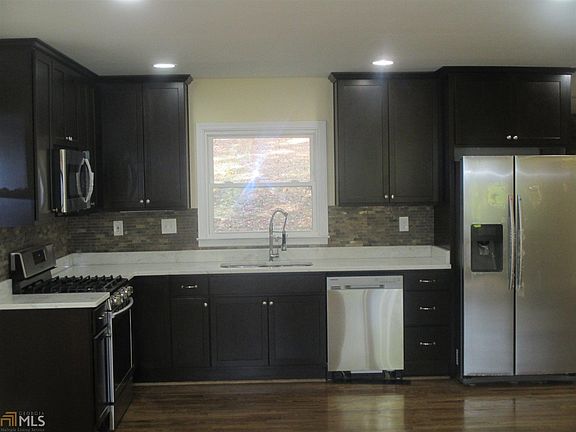 Stained 42' cabinets and new Samsung Stainless Steel Appliances, Marble Countertops, Original Hardwo