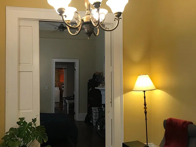 Living room with chandelier and pocket door