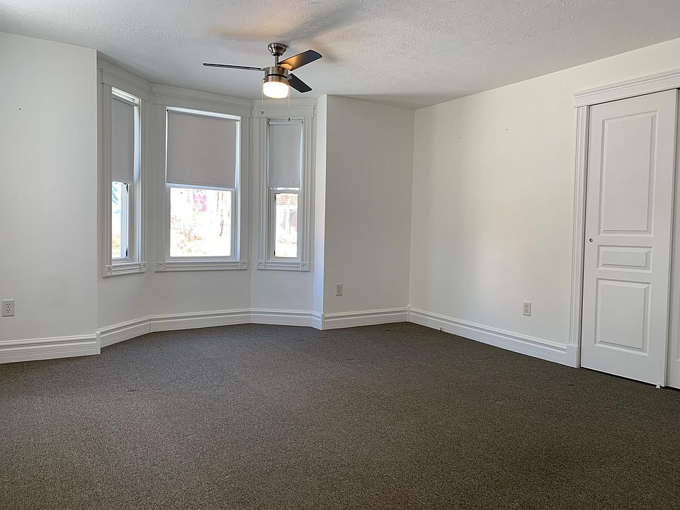 living room with bay window and lots of natural light