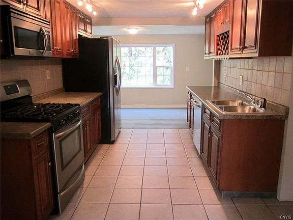 The updated Kitchen is ideally situated between the Family Room and the Greatroom - perfect for entertaining!