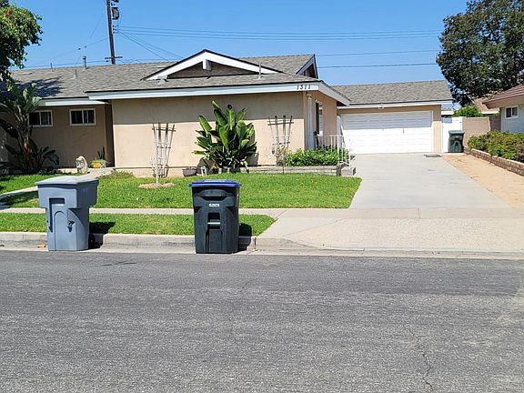 Front of House with long driveway