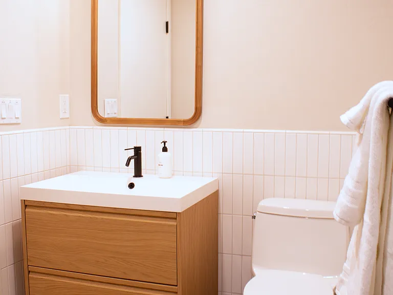 Clean, modern bathroom with vanity and updated fixtures.
