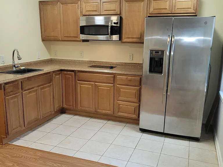 The kitchenette has a full size refrigerator and ample cabinet space.