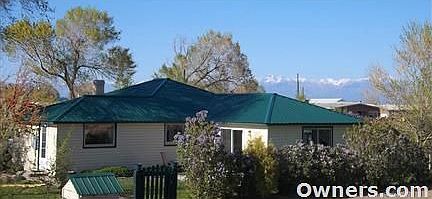 House in spring with Snowcapped Sangre de Cristo Mountains