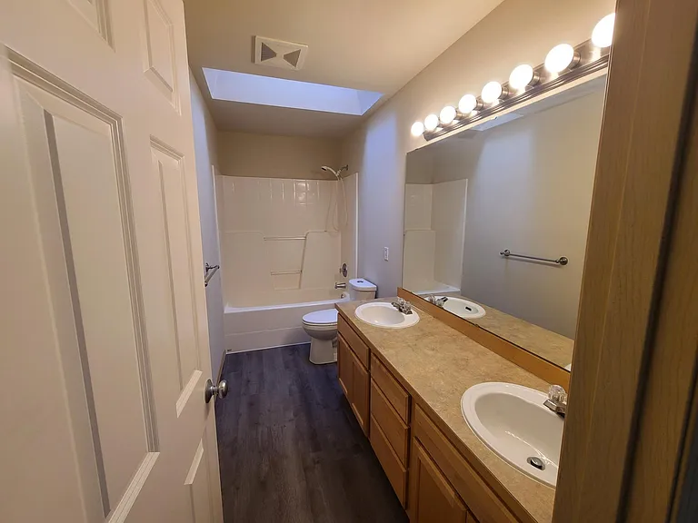 2nd floor bathroom with new toilet, fresh paint and new flooring.