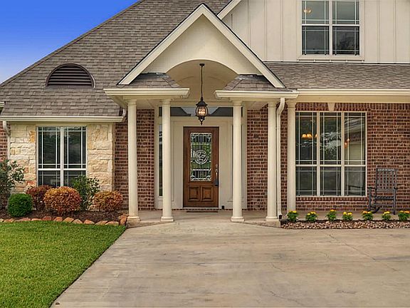 The essence of "home" is felt here with the tastefully designed covered front Porch with a barreled arch providing the finishing touch