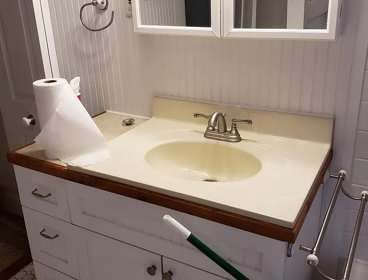 Standard sink and medicine cabinet.