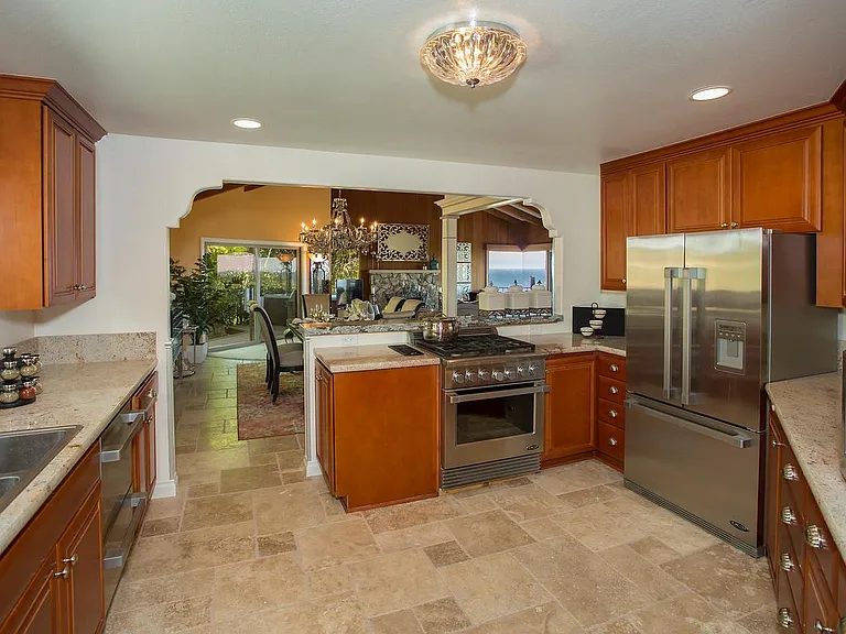 Step into a fully stocked gourmet kitchen, outfitted with high-end appliances and everything you need to create memorable meals.