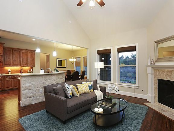 Gather with family & friends around a cozy fire or enjoy the beautiful views of your sizable backyard & the greenbelt behind it. Conversation flows easily between the living and kitchen areas, and the breakfast bar is perfect for serving snacks!