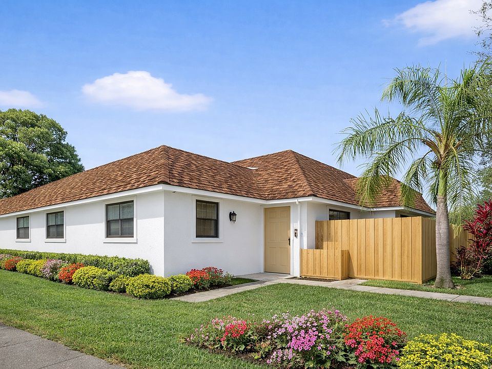 Single story villas with private fenced in patios, just steps from the lake