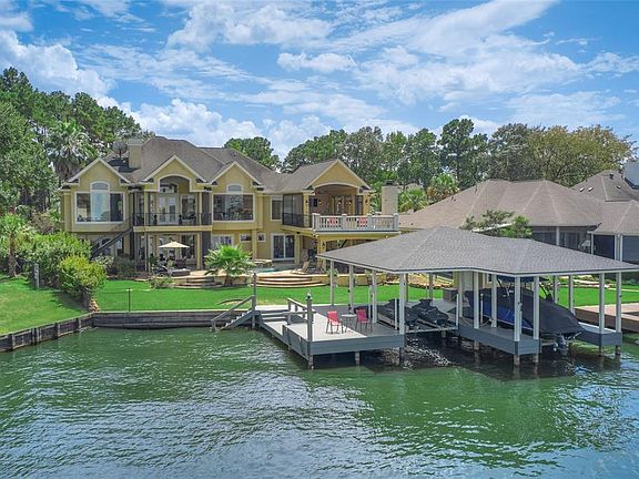 Bring all of your lake toys and enjoy lake living to the fullest in this dream home.