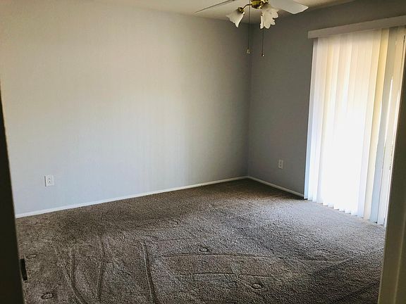 Bedroom with patio door to back yard.