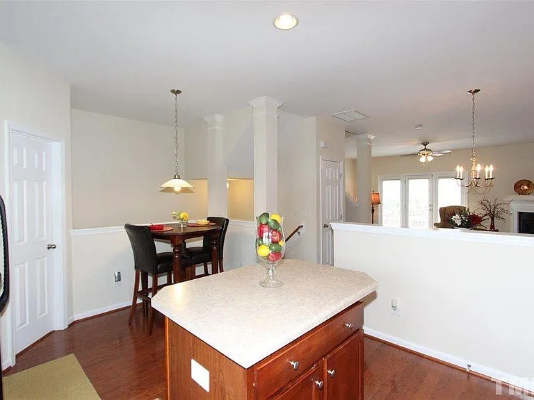 View of breakfast nook & staircase from corner of kitchen