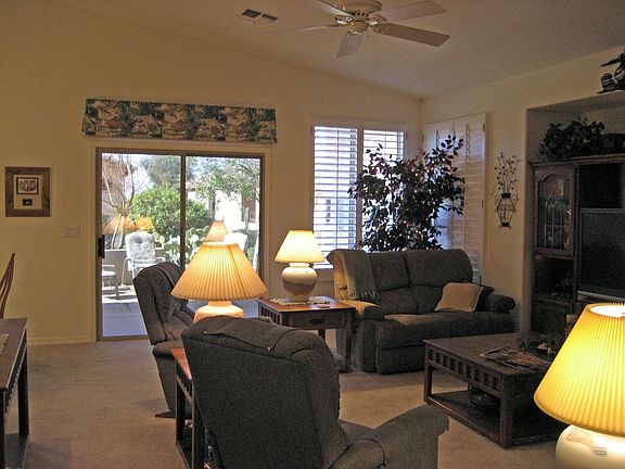 Great room,entertainment niche,plantation shuttters