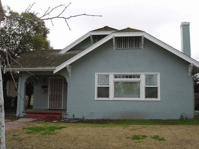 Front of the house. Driveway to the left.