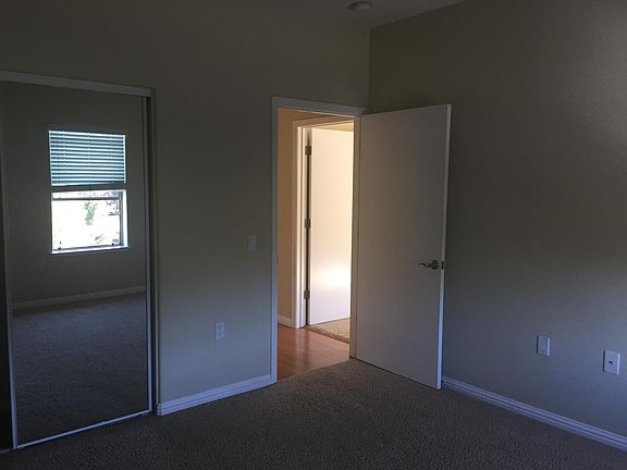 2nd bedroom with large closet and mirrored doors