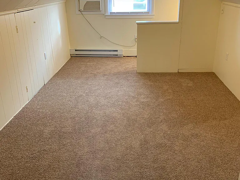 Bedroom (view to back wall and stairs)