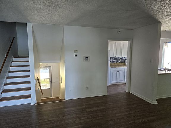 View of steps & kitchen from 1st level deck door.
