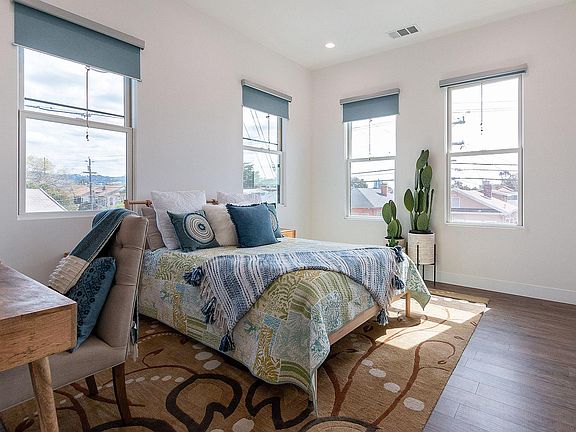 Large bedroom with east and south-facing windows