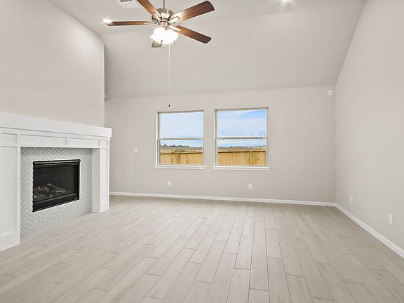 Open, airy great room with cozy fireplace