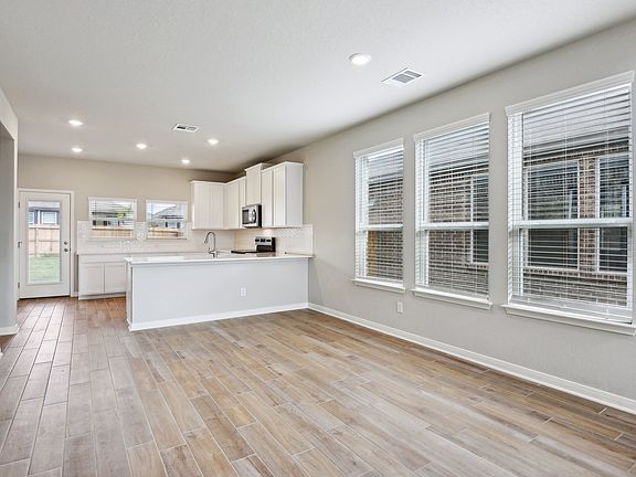 Dining room in the Medina floorplan at a Meritage Homes community.