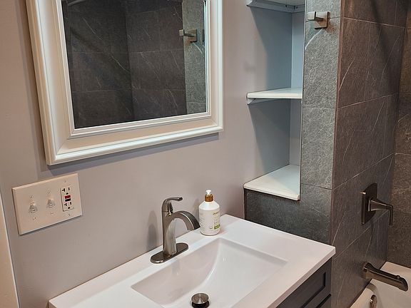 New renovated bathroom with all new fixtures. Bathroom storage.