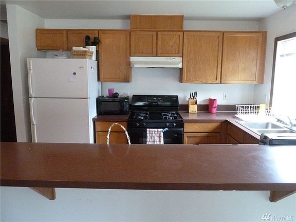 Efficient kitchen. Check out the great bar area. All open to living and dining.