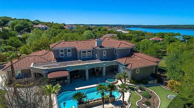 The gorgeous back yard has all your needs for outdoor entertaining.  This community is on Lake Travis with it's own Marina.