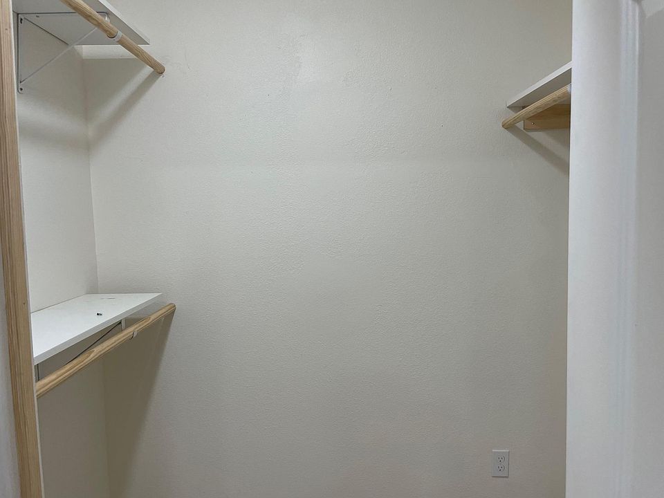 Walk in closet in bedroom