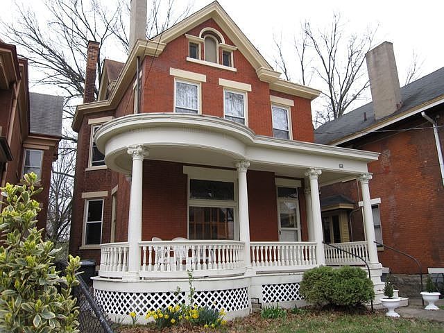 Beautiful brick home with a large covered porch, perfect for spring.