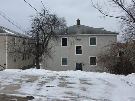 Back of building and parking lot