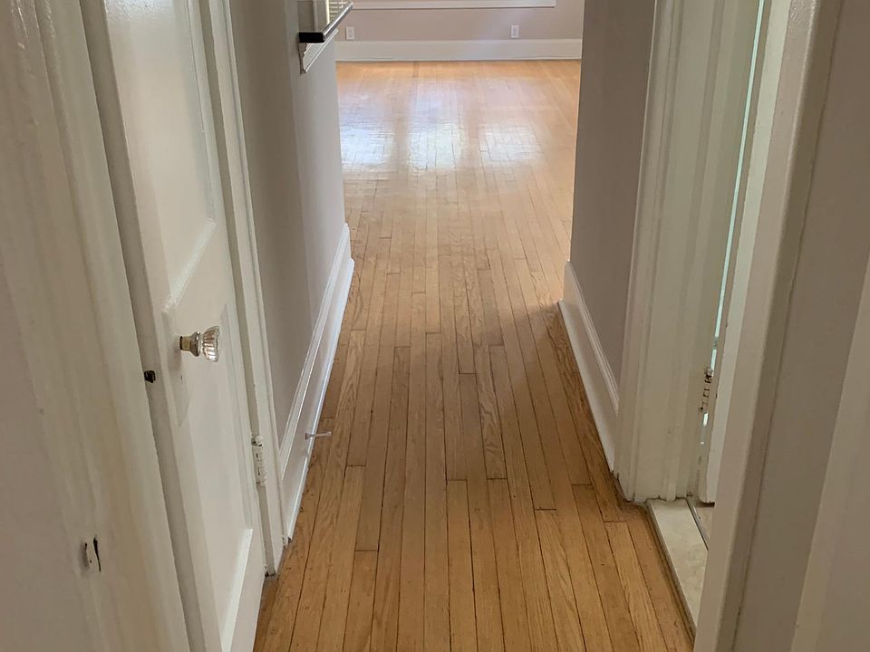 Hallway with washer dryer closet on the left bathroom on the right