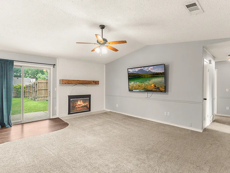 living room with wood burning fireplace