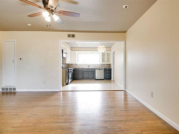 View from front door--open living space to kitchen area.