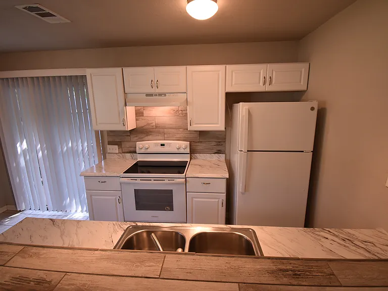 Cute little kitchen with adjacent dinning area.