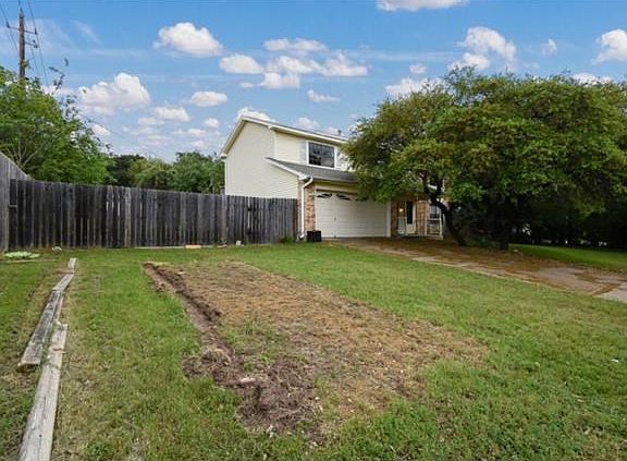 Plenty of side yard that just beckons a garden to grow here.  And room for a game of ball, too.
